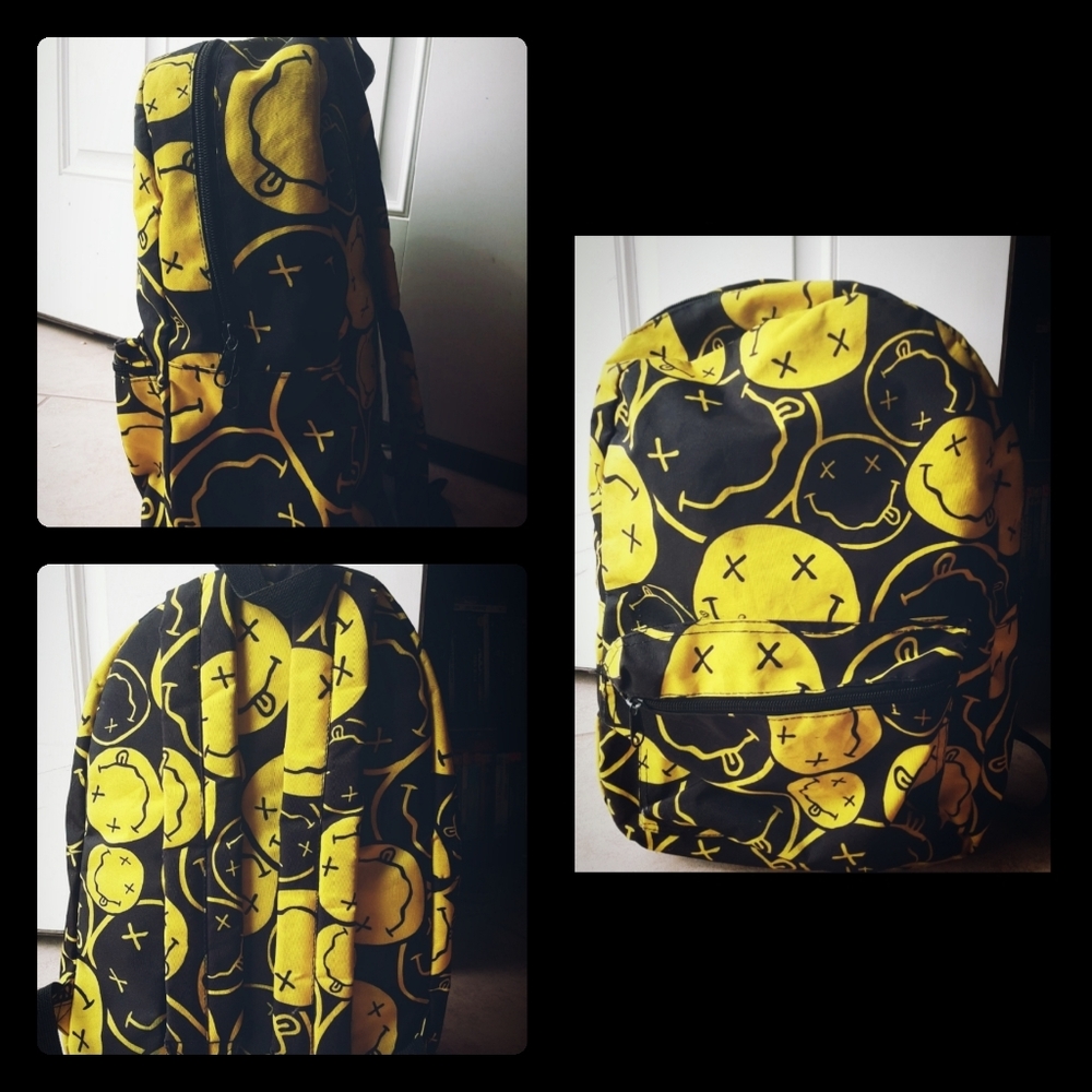 Black and yellow Spencer's emoji backpack